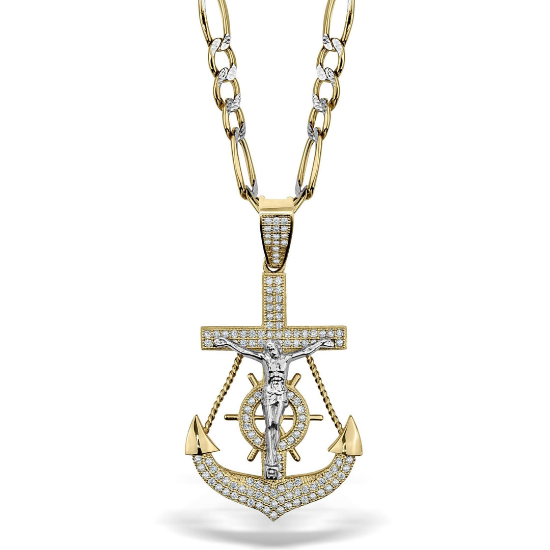 Two-tone gold crucifix and anchor pendant paved with sparkling cubic zirconia stones.