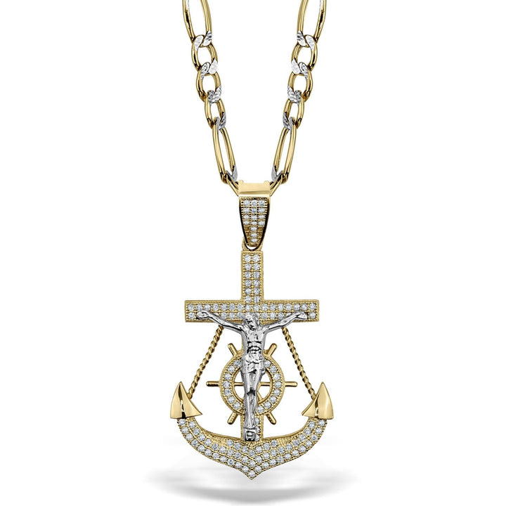 Two-tone gold crucifix and anchor pendant paved with sparkling cubic zirconia stones.