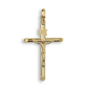 Polished yellow gold tubular INRI crucifix pendant featuring a detailed Jesus figure on a white background.