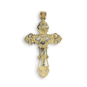 Back view of two-tone gold INRI crucifix pendant charm isolated on white backdrop.