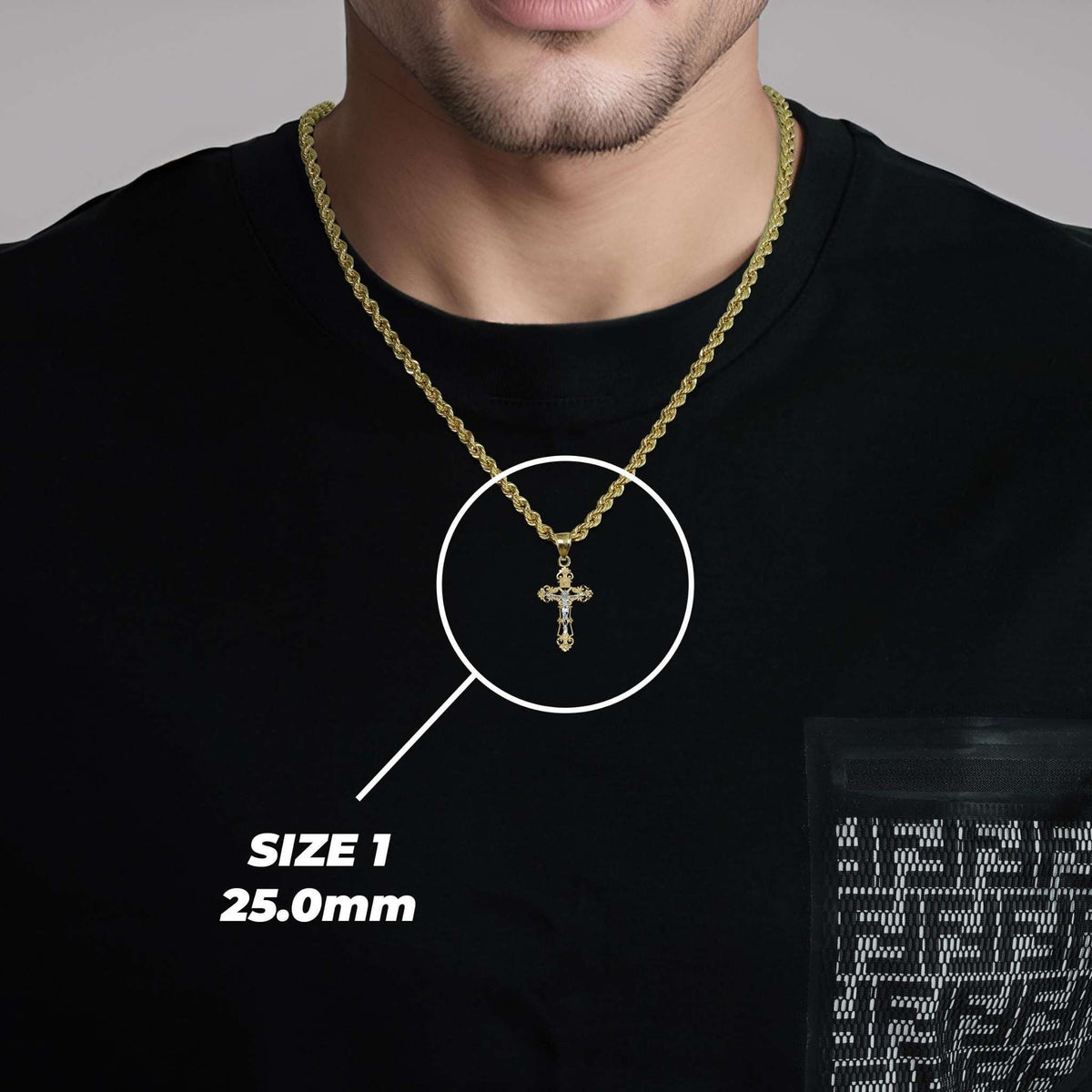 Man wearing black t-shirt modeling Size 1 25.0mm gold INRI crucifix pendant necklace.