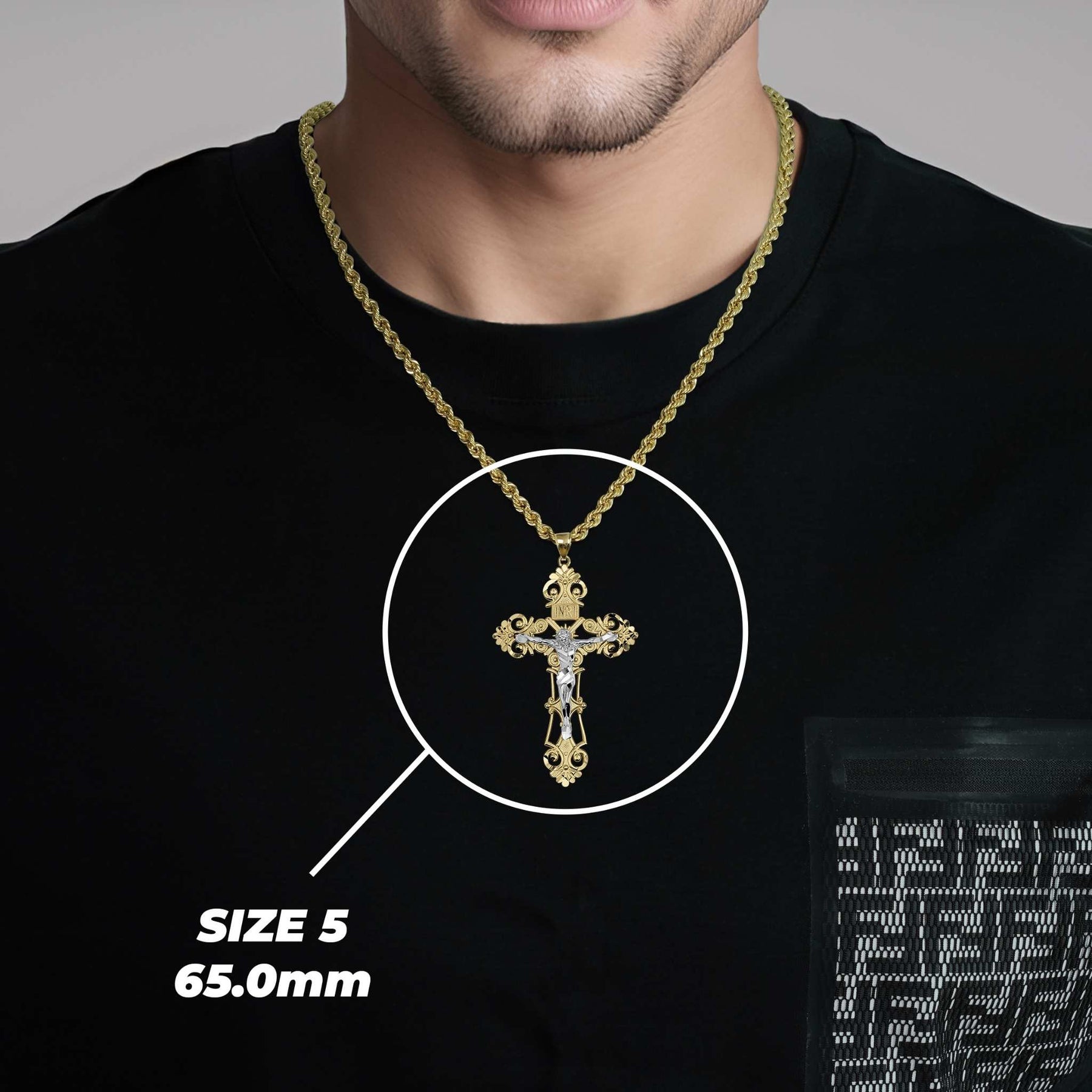 Man wearing a size 5 gold cross pendant necklace with a size label reading 65.0mm.