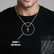 Man wearing a size 1 gold cross pendant over a black t-shirt with a size callout.
