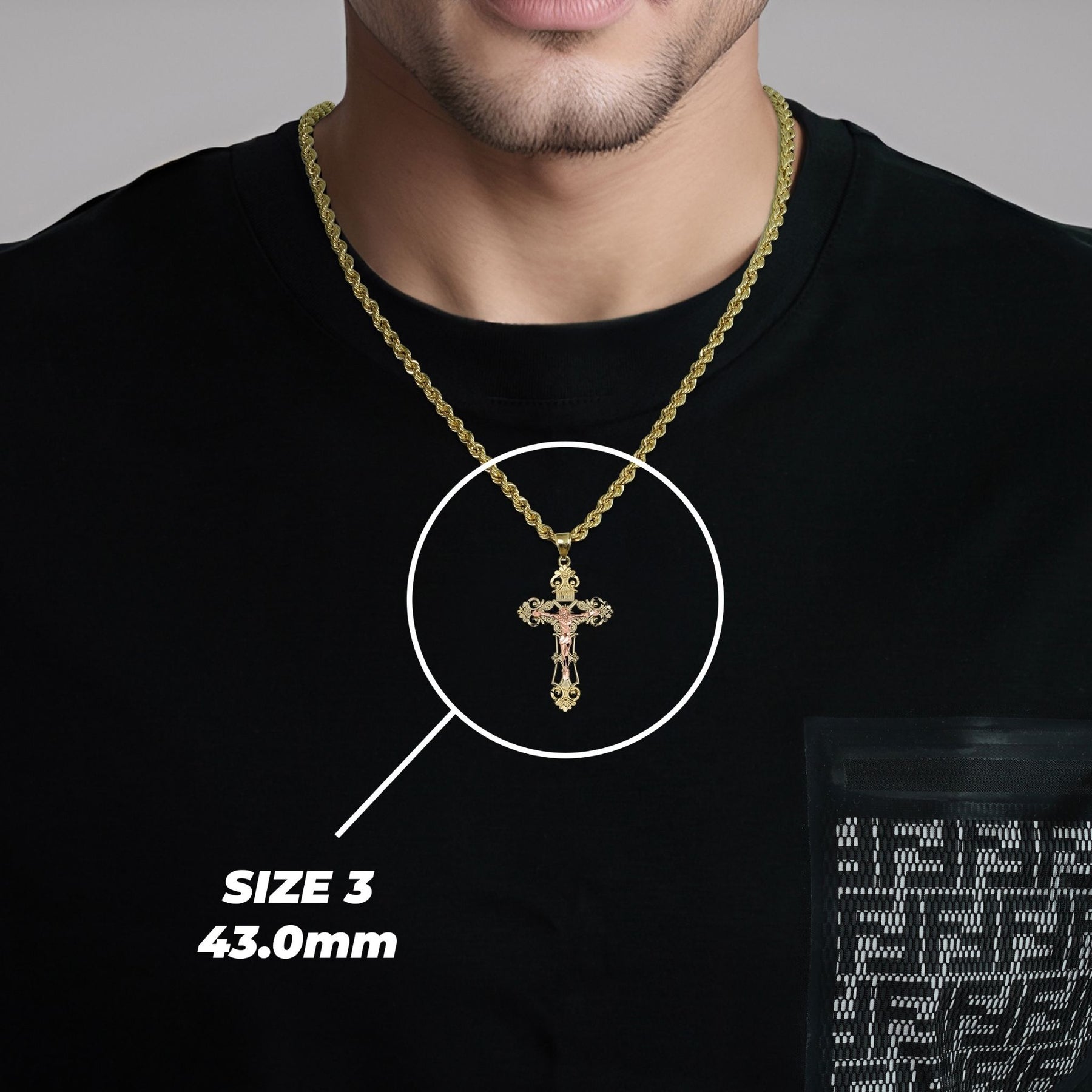 Man wearing the Size 3 (43.0mm) gold cross pendant necklace with size overlay.