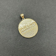 Back view of round gold Last Supper pendant featuring textured sunburst pattern.