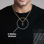 A man wearing an X Small two-tone gold crucifix pendant labeled 23.0mm.