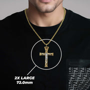 A man wearing a 2X Large gold crucifix pendant labeled 2X LARGE 72.0mm.