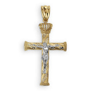 A two-tone gold crucifix pendant with a white gold corpus and crown on white.