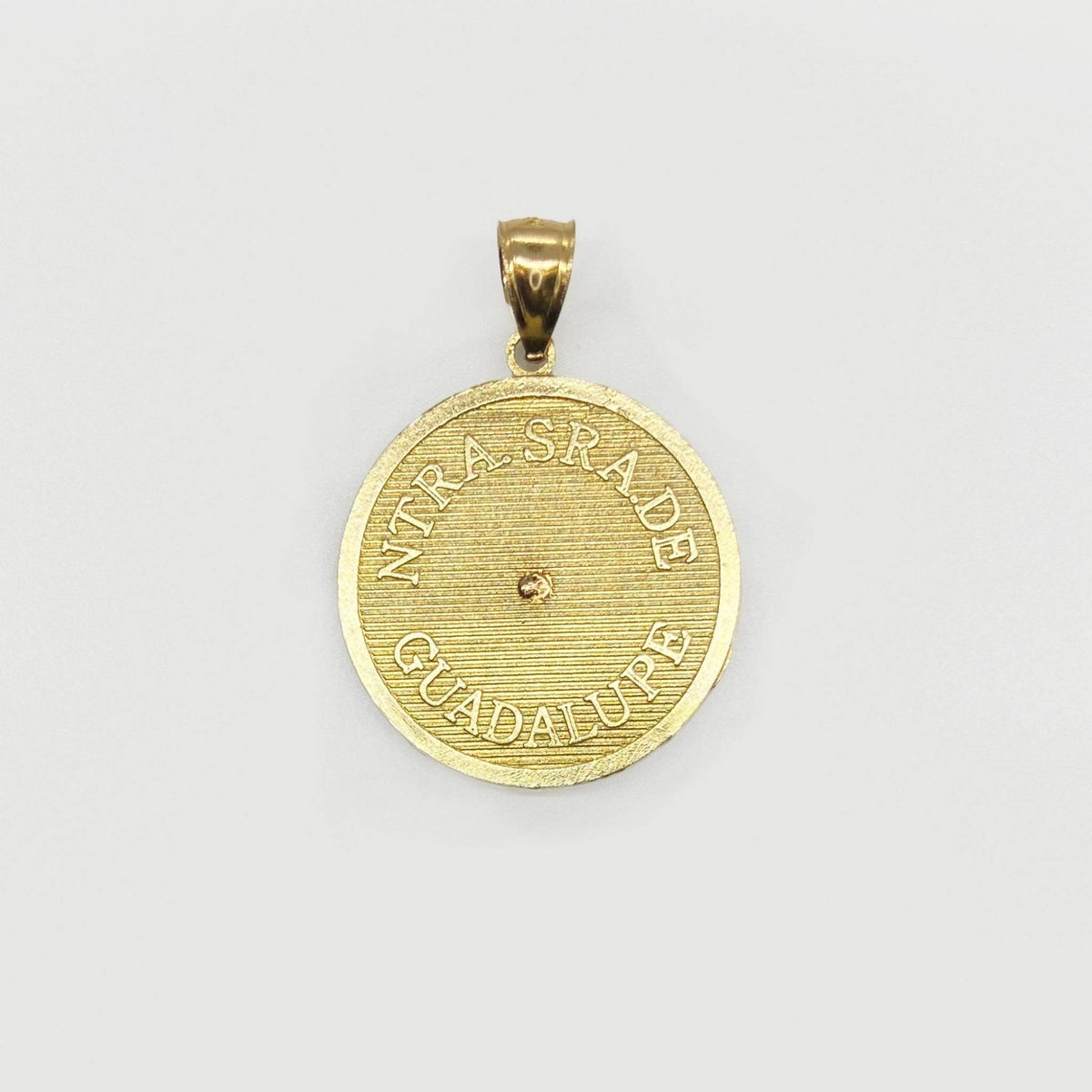 Back view of two-tone gold Virgin Mary Lady of Guadalupe round pendant.