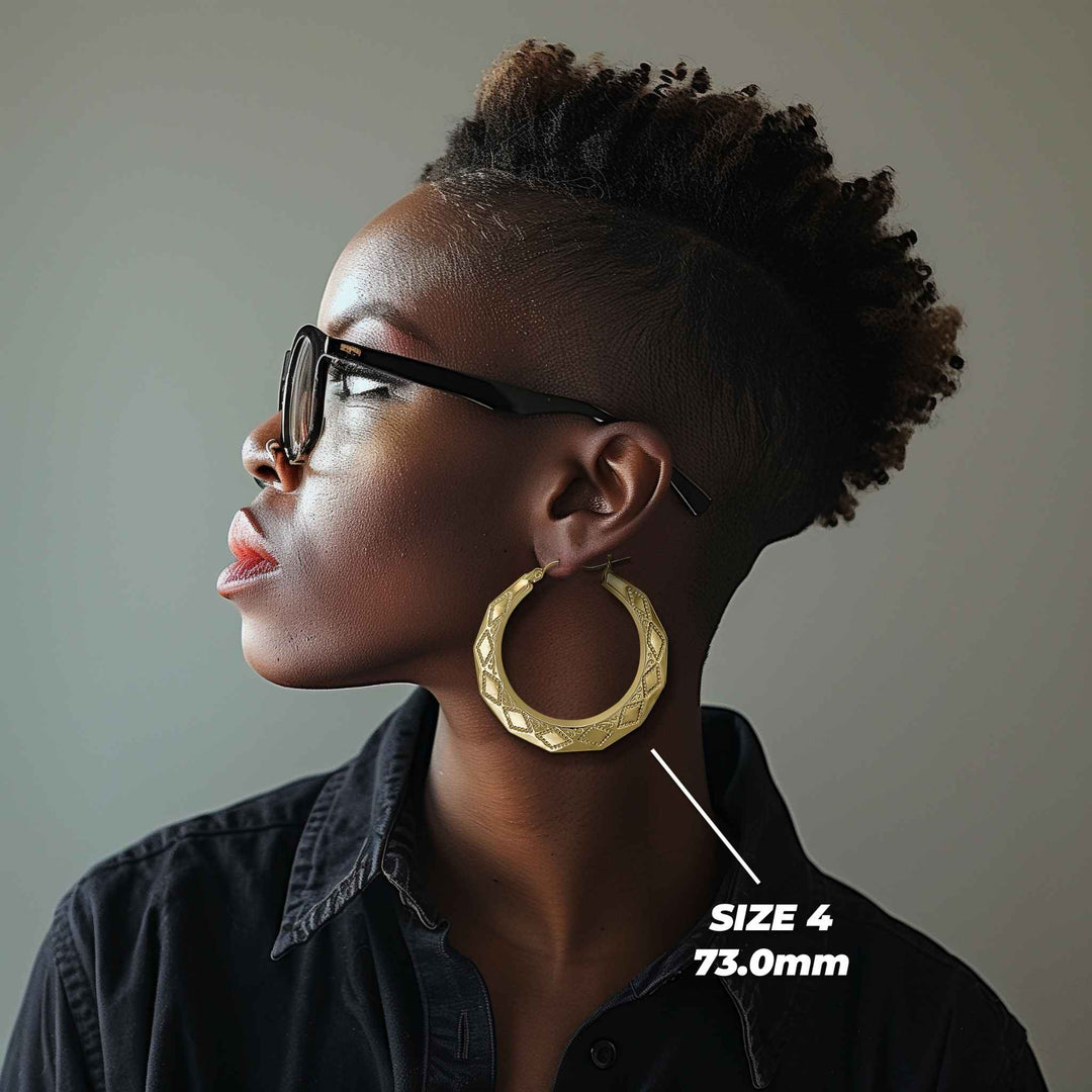 Model wearing Size 6 73.0mm textured gold rhombus hoop earrings for size reference.