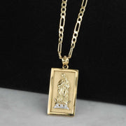 Rectangular two-tone gold Virgin Mary Guadalupe pendant on a classic Figaro chain.