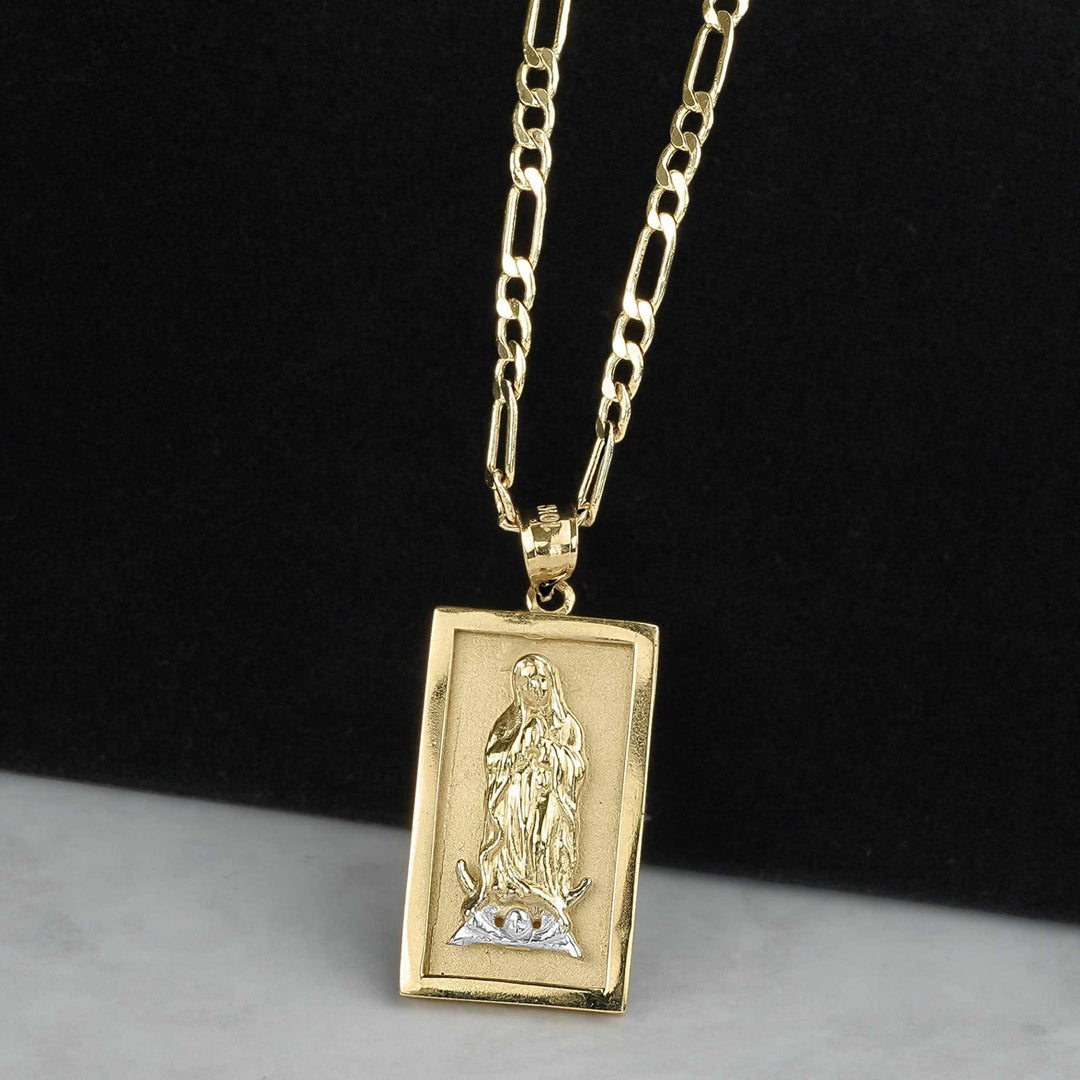 Rectangular two-tone gold Guadalupe pendant hanging on a gold chain against a dark background.