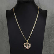 Tri-color gold Virgin Mary Guadalupe heart pendant necklace displayed on black bust.
