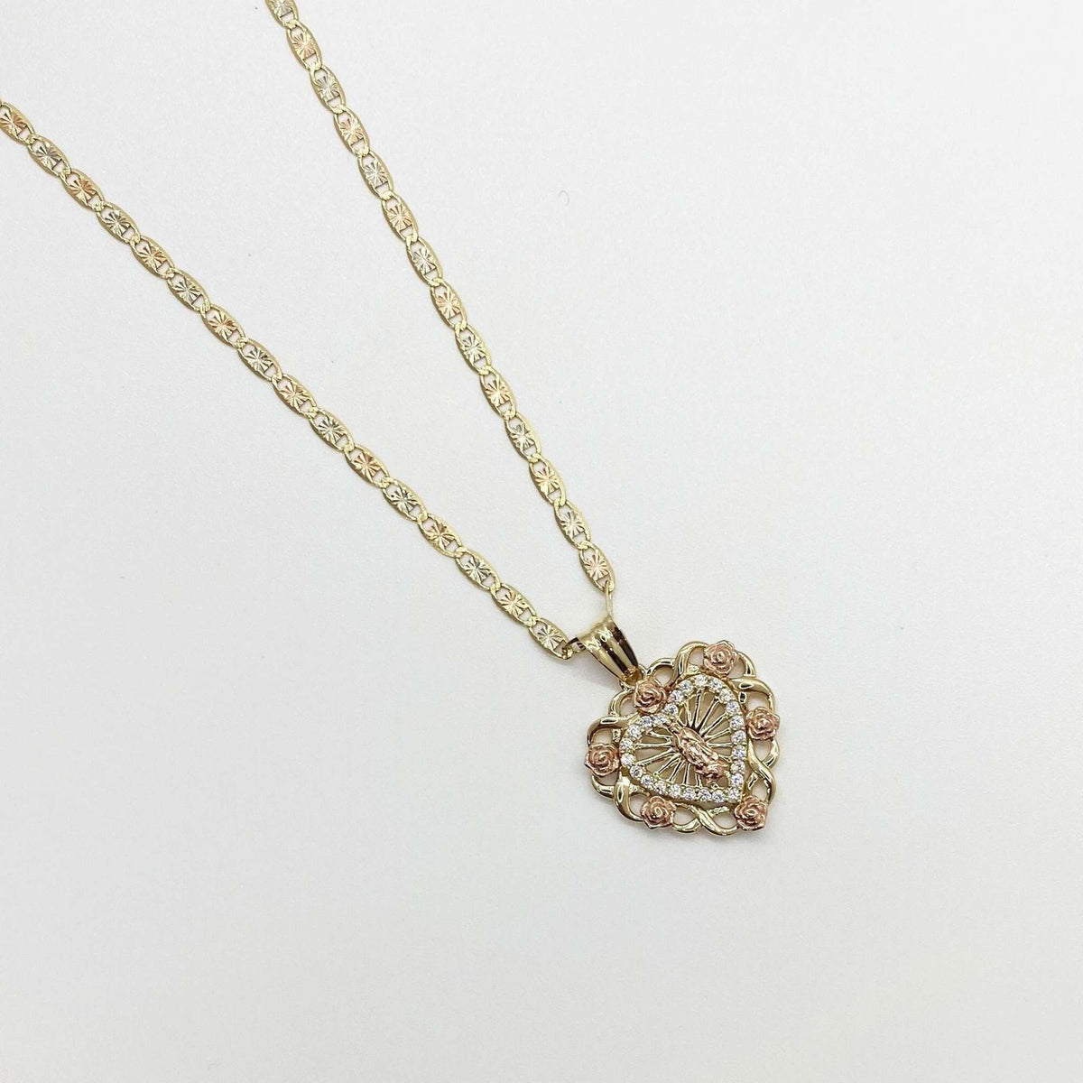 Tri-color gold Virgin Mary heart pendant necklace with rose gold flowers and CZ halo.