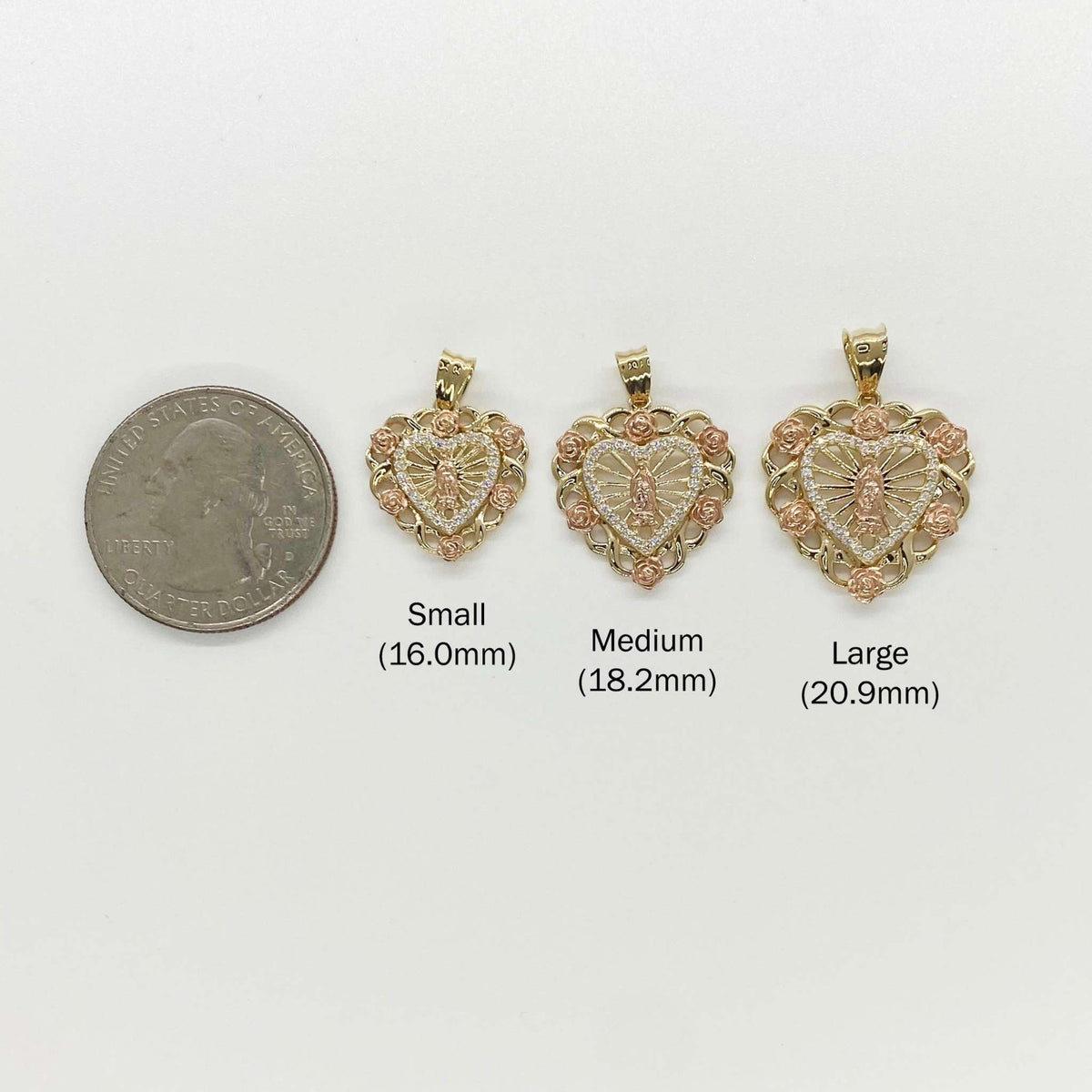 Size chart comparing Small, Medium, and Large Virgin Mary heart pendants next to a quarter.