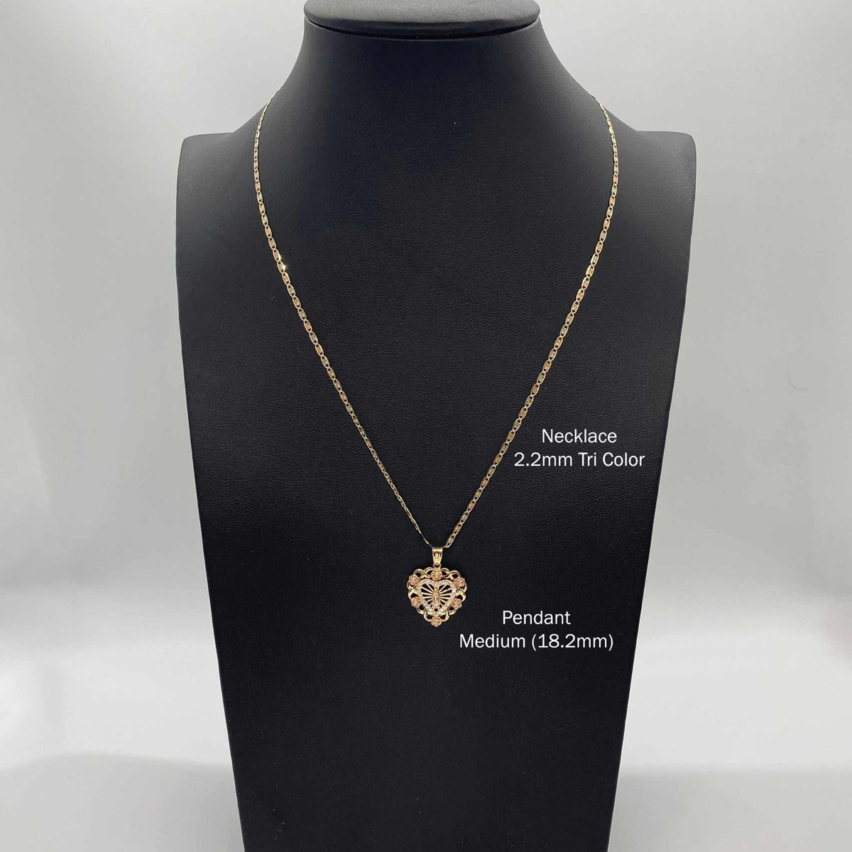 Medium Virgin Mary heart pendant necklace shown on black display bust with size labels.