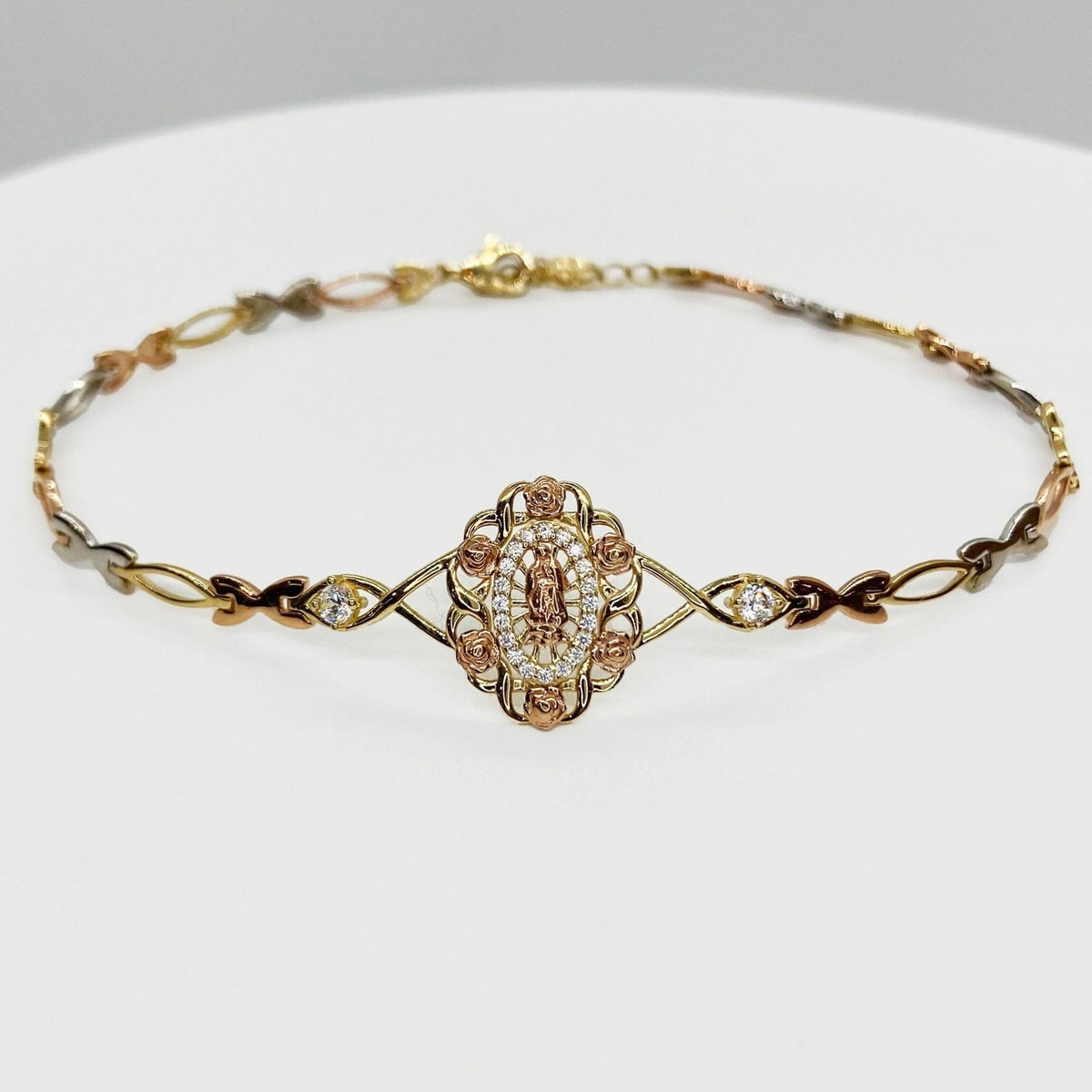 Tri-color gold Virgin Mary Guadalupe bracelet with rose floral medallion and CZ accents.