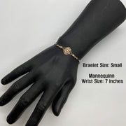Small size tri-color gold Virgin Mary Guadalupe bracelet displayed on a black mannequin hand