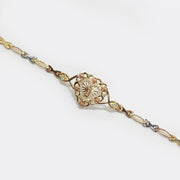 Tri-color gold Virgin Mary Guadalupe heart medallion chain bracelet with CZ accents.
