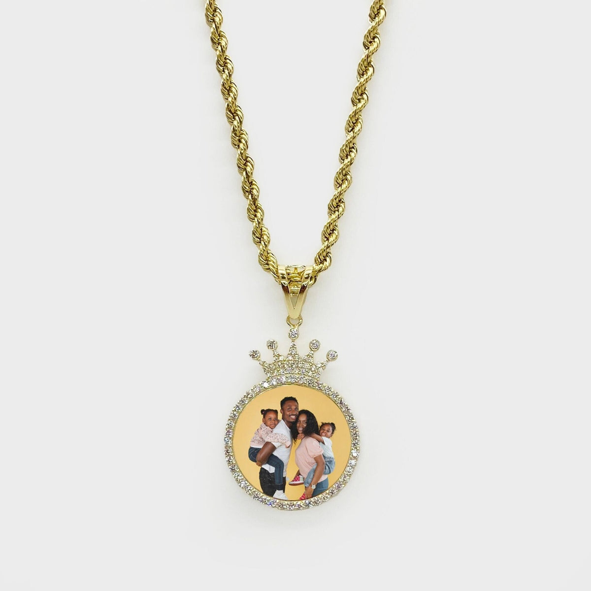 Front view of a gold memorial picture crown pendant necklace featuring a custom photo.