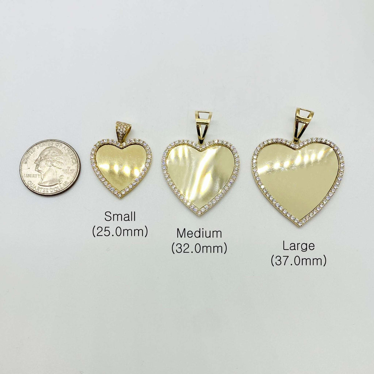 Gold heart-shaped CZ picture pendants in Small, Medium, and Large sizes with millimeter dimensions.