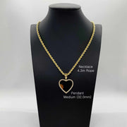 Medium 32.0mm gold heart CZ memorial pendant necklace on 4.3mm rope chain displayed on black mannequin.