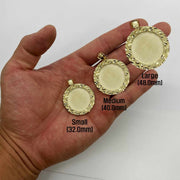 Hand holding three gold nugget round picture pendants labeled small, medium, and large.