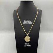 Small 32mm gold nugget pendant on a 3.0mm rope chain displayed on black stand.