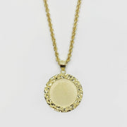 Round gold pendant necklace with a textured nugget border and smooth center for pictures