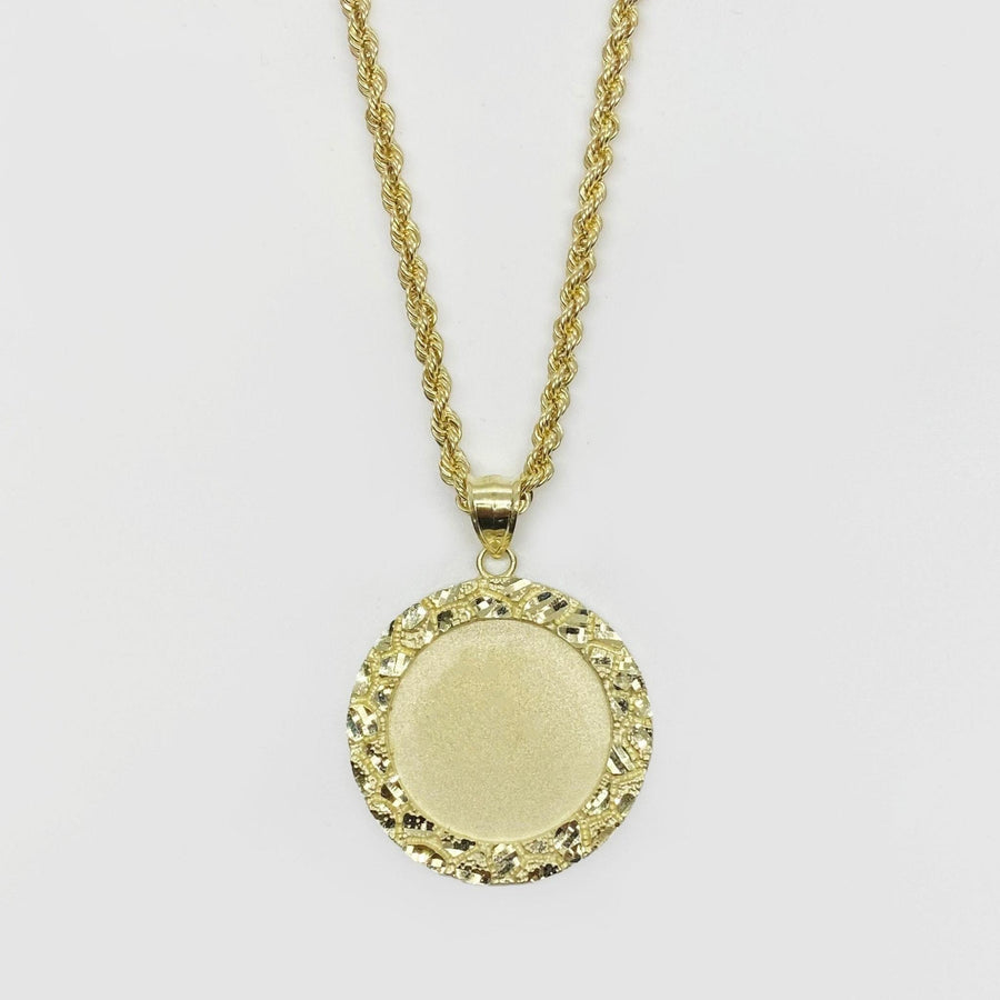 Round gold pendant necklace with a textured nugget border and smooth center for pictures