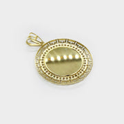 Front angled close-up of a round gold memorial picture frame pendant with cubic zirconia
