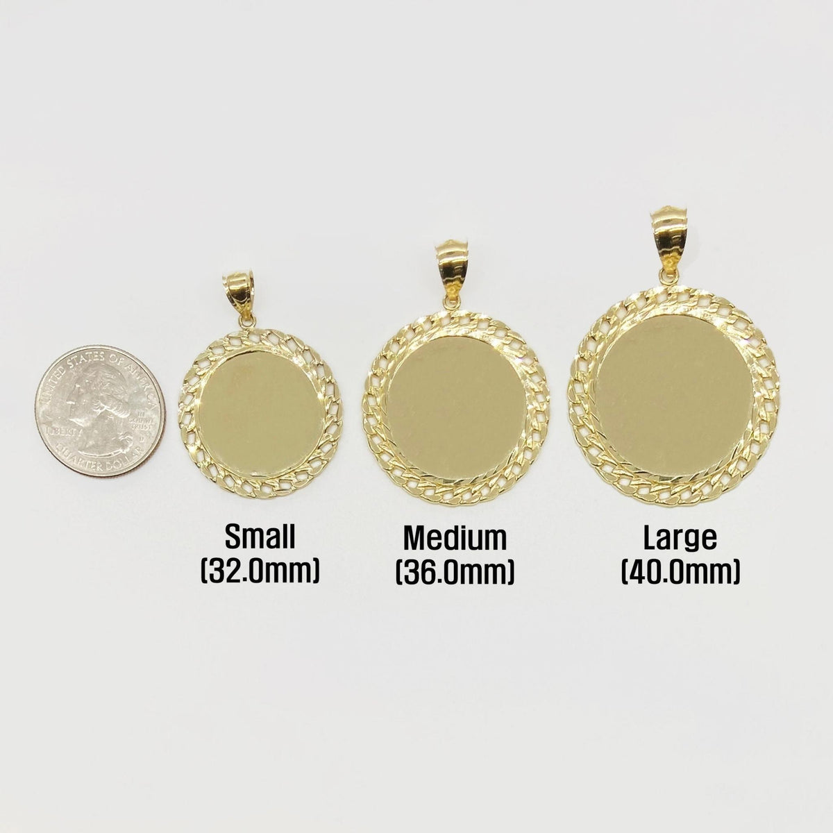 Three sizes of round gold picture pendants next to a quarter for scale.