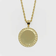 Gold round memorial picture pendant with a Cuban-link style frame on a rope chain.