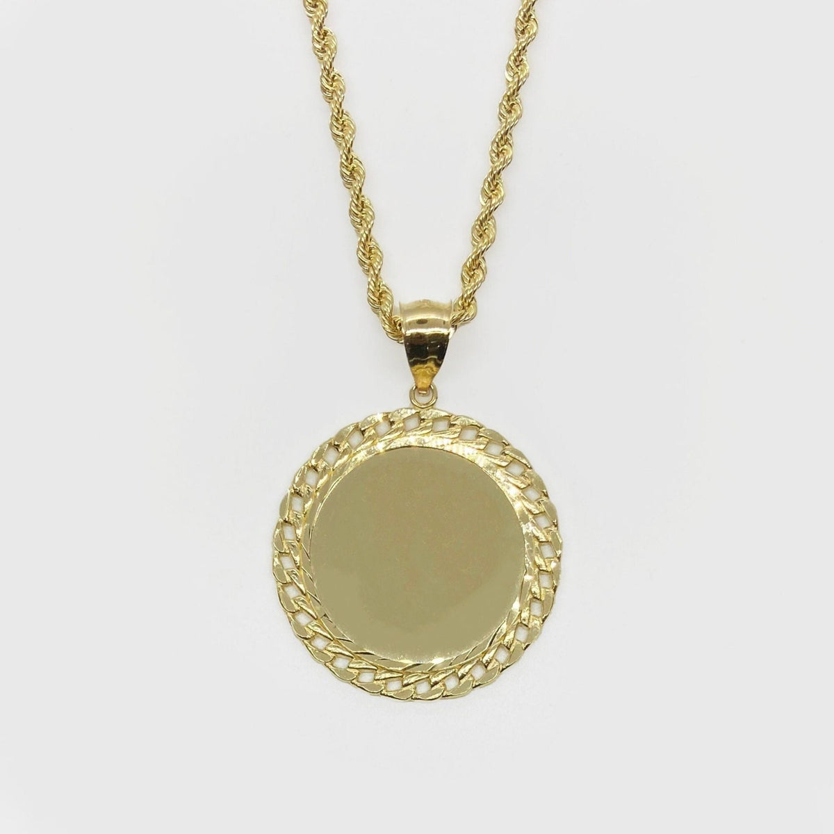 Gold round memorial picture pendant with a Cuban-link style frame on a rope chain.