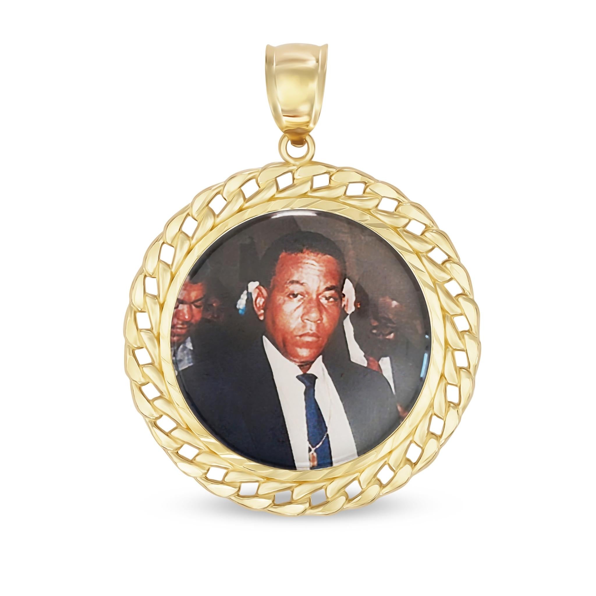 Studio shot of gold memorial pendant featuring a custom photo insert of a man.