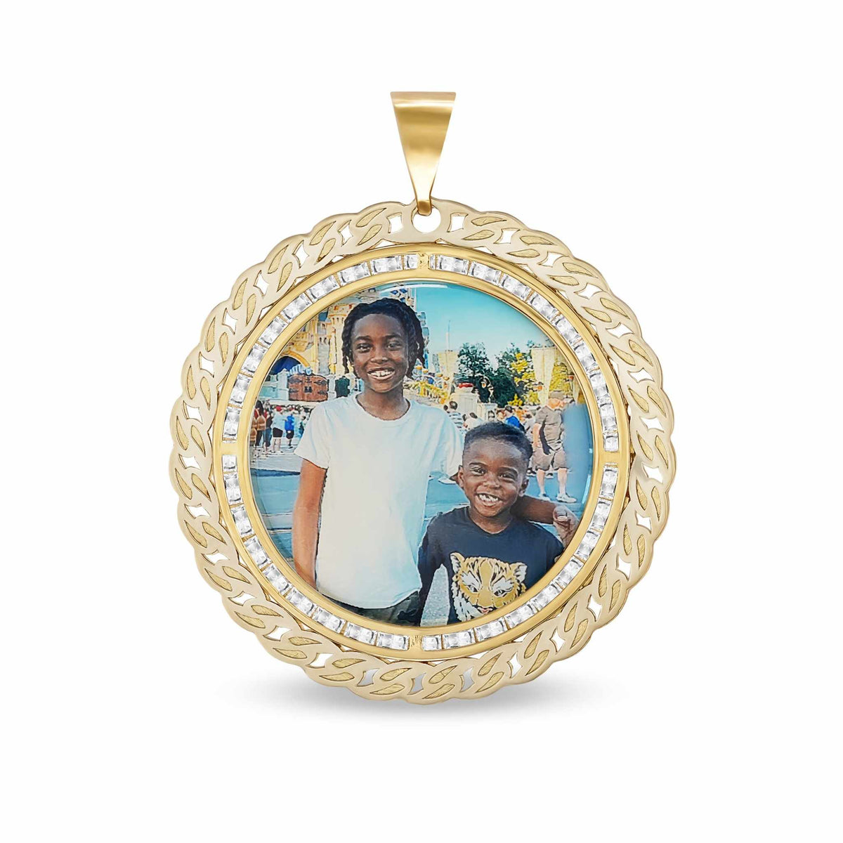 Round 10k gold memorial pendant featuring a custom photo of two children and a Cuban link border.