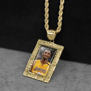Gold memorial rectangle pendant necklace featuring a Kobe Bryant Los Angeles Lakers photo.