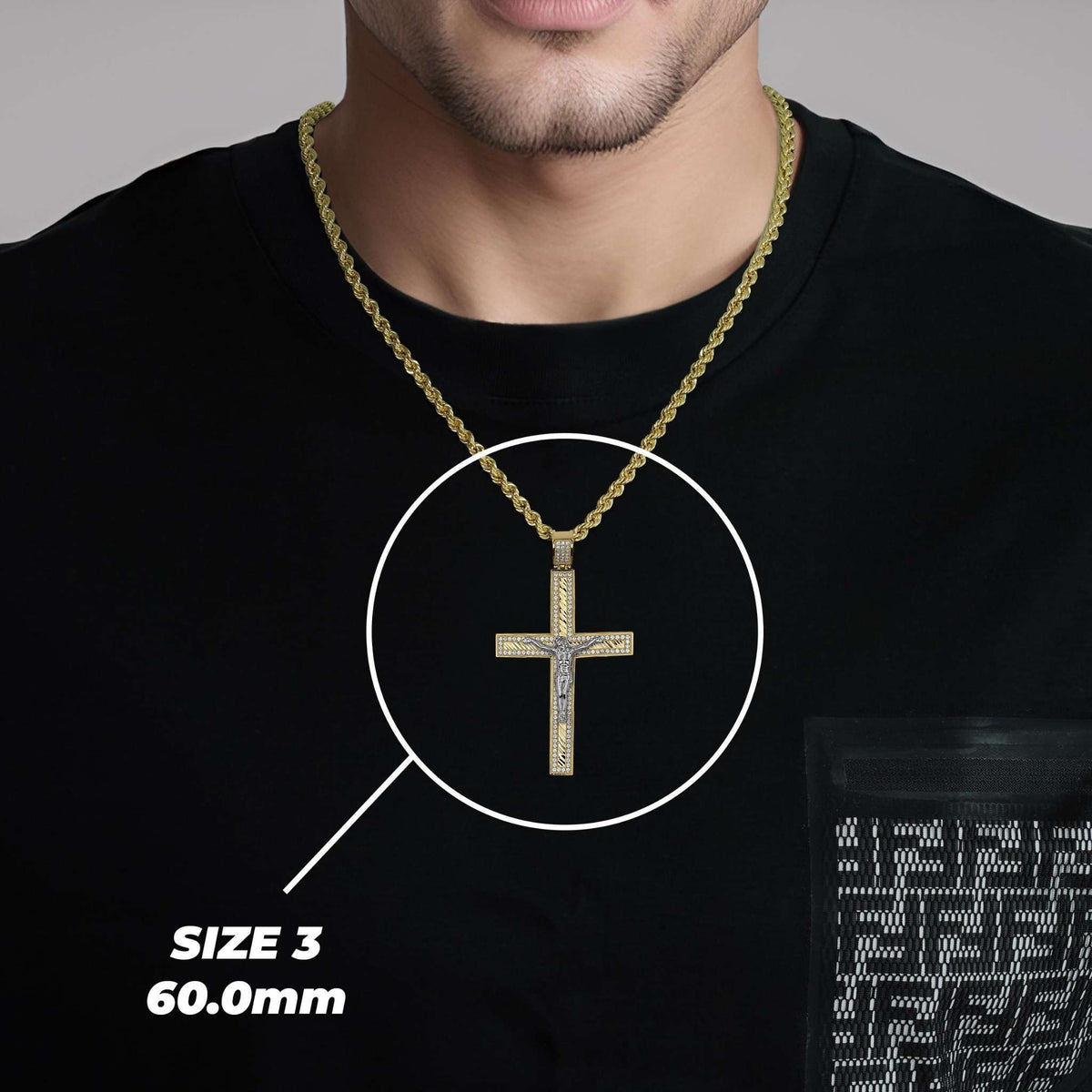 On-model size display of Size 3 (60.0mm) gold Nemo iced crucifix cross pendant necklace.
