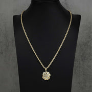 Gold nugget round CZ pendant on rope chain displayed on a black mannequin bust.