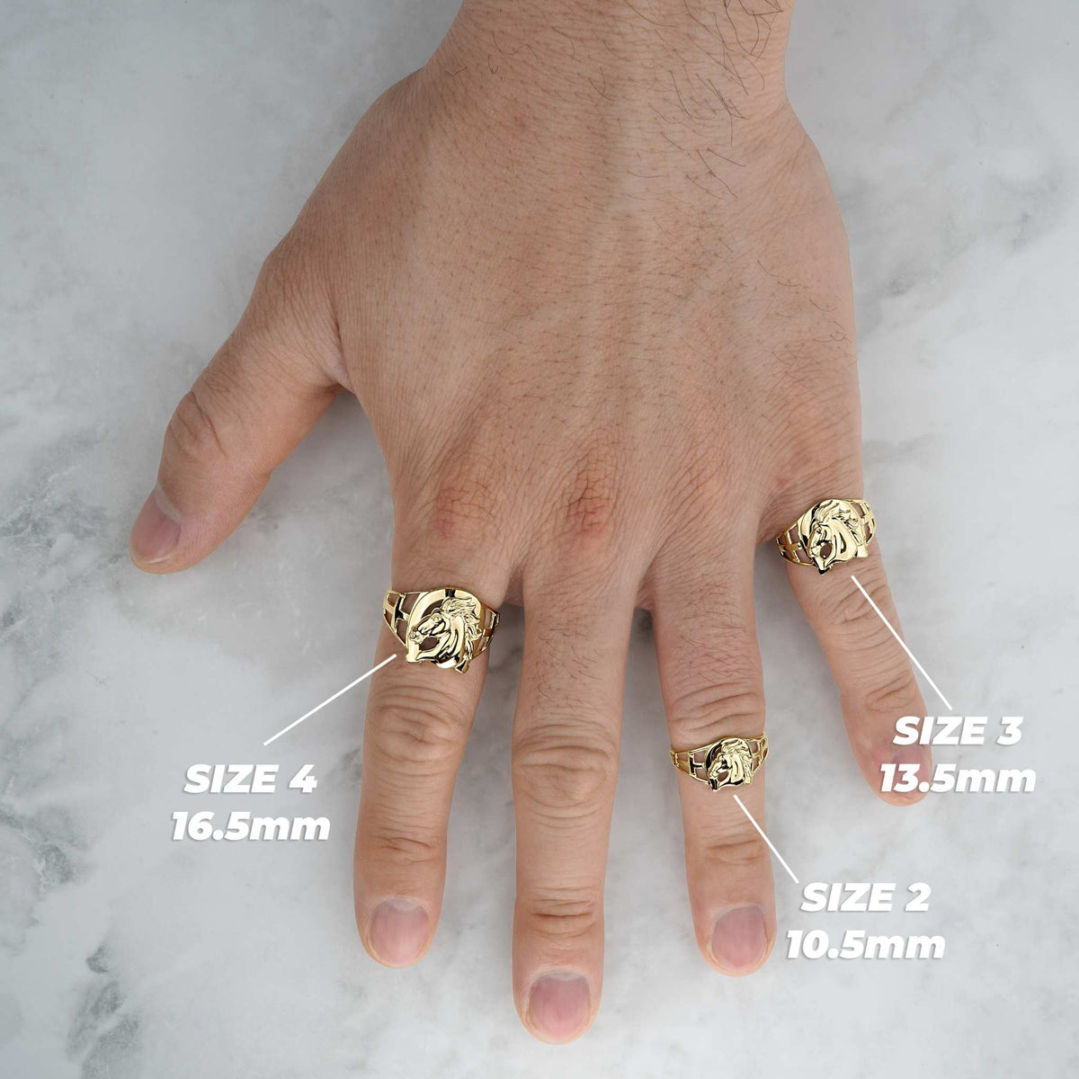 Lifestyle hand view of three gold horse horseshoe rings with millimeter size labels.