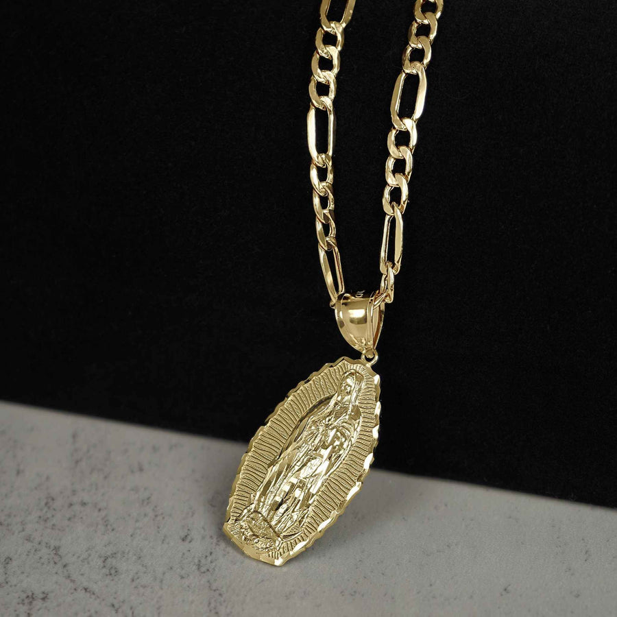 Gold Virgin Mary Guadalupe oval medallion attached to a gold figaro chain.