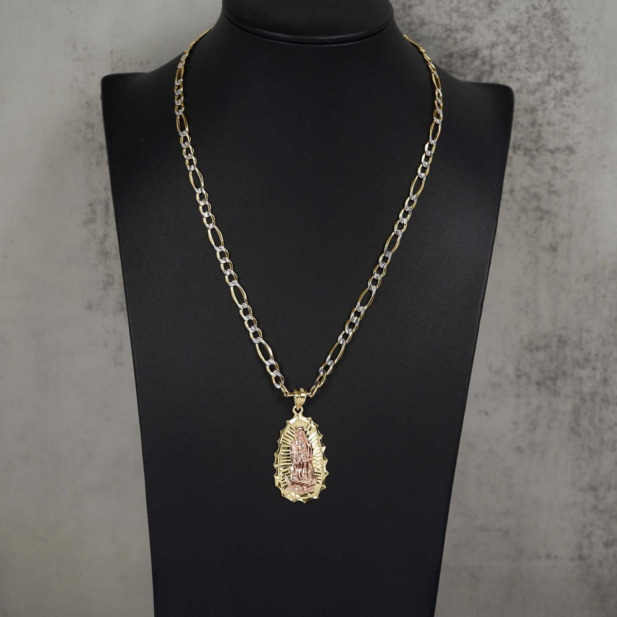 Two-tone rose and yellow gold Ovo Guadalupe pendant necklace on black display bust.