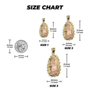 Size chart comparing three two-tone gold Ovo Guadalupe pendants to a US quarter.