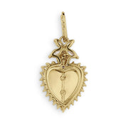 Back view of a yellow gold sacred heart pendant against a white background.