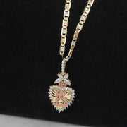 Gold Quinceañera heart pendant with 15 design, CZ accents, and rose gold floral detail.