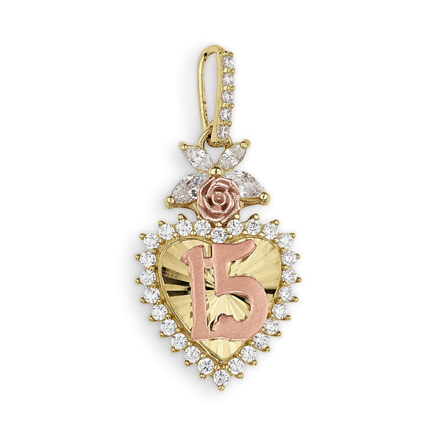 Two-tone gold heart pendant with a 15, rose detail, and clear stones on white.