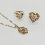 Tri-color gold Quinceanera jewelry set including a pendant, earrings, and ring with rose accents.