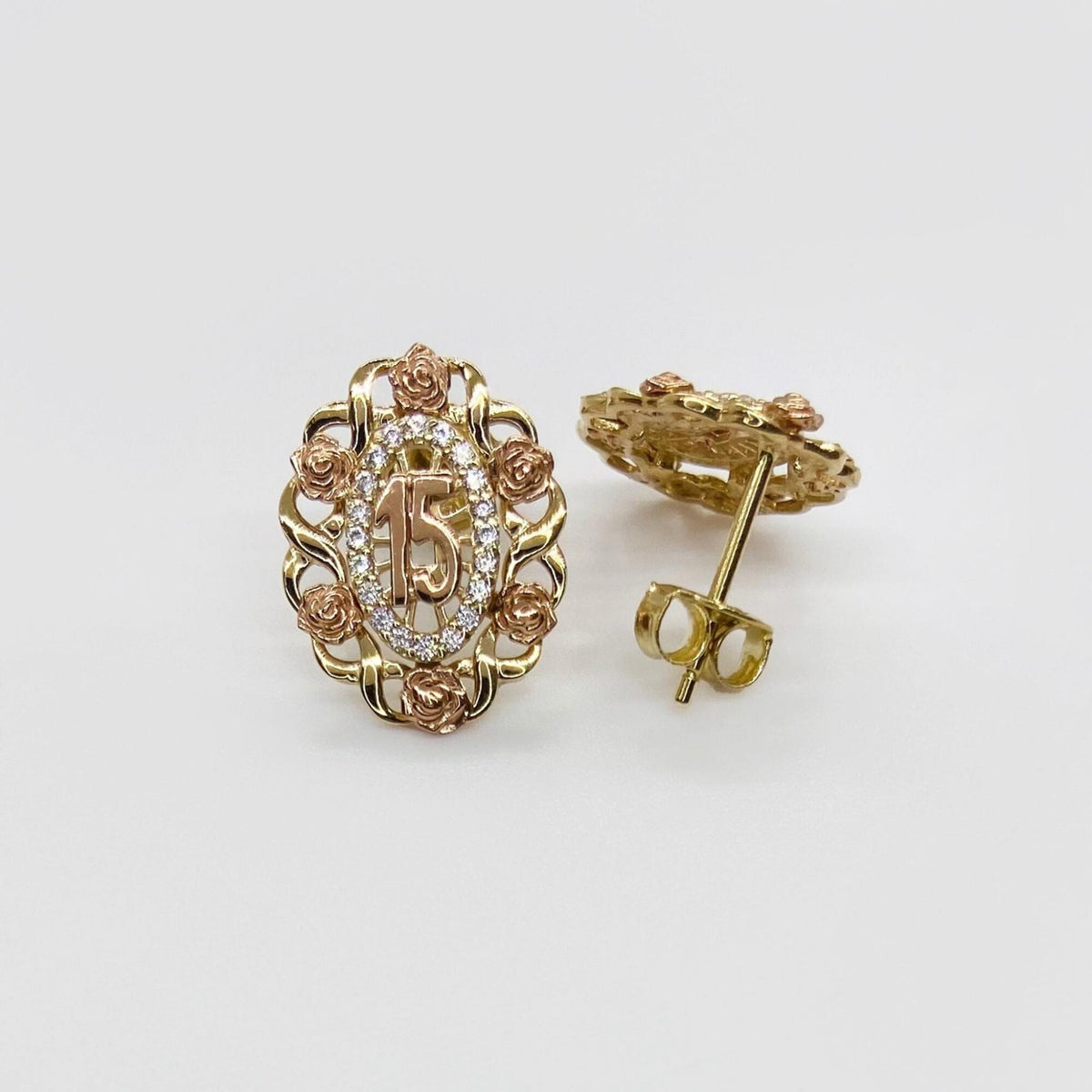 Tri-color gold Quinceanera stud earrings featuring a number 15 surrounded by rose accents.