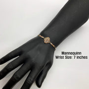 Tri-color gold Quinceañera 15 rose bloom bracelet displayed on a 7-inch mannequin wrist