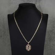 Tri-color gold Quinceañera '15' pendant necklace displayed on a black mannequin bust.